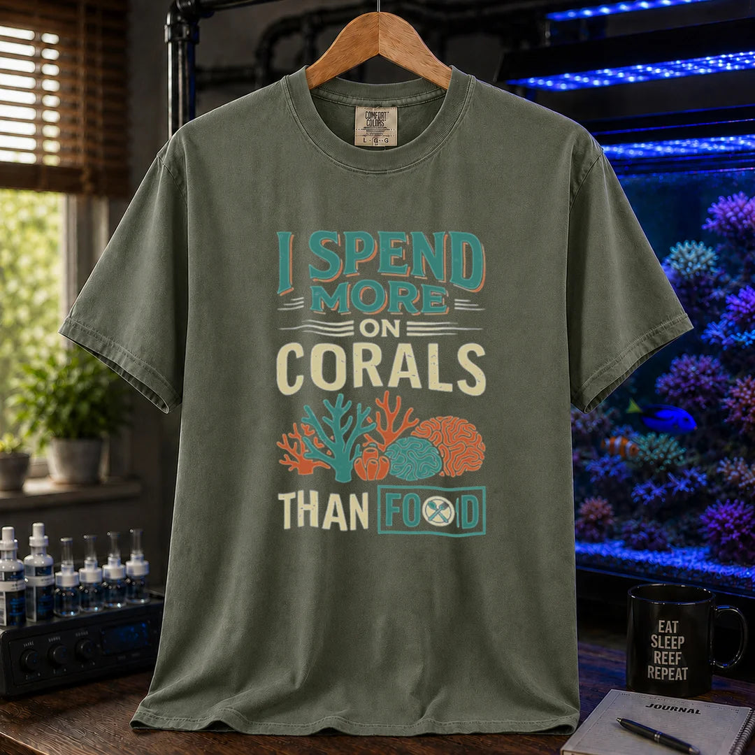 Saltwater aquarium graphic t-shirt featuring a colorful coral illustration and text: I SPEND MORE ON CORALS THAN FOOD, military green crew neck tee