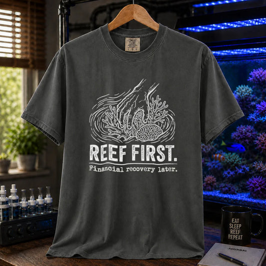 Saltwater aquarium graphic t-shirt featuring a hand tending corals illustration and text: REEF FIRST. Financial recovery later., dark grey crew neck tee