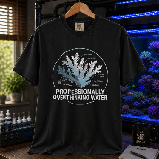 Saltwater aquarium graphic t-shirt featuring a scientific coral diagram with water parameters and text: PROFESSIONALLY OVERTHINKING WATER, black crew neck tee
