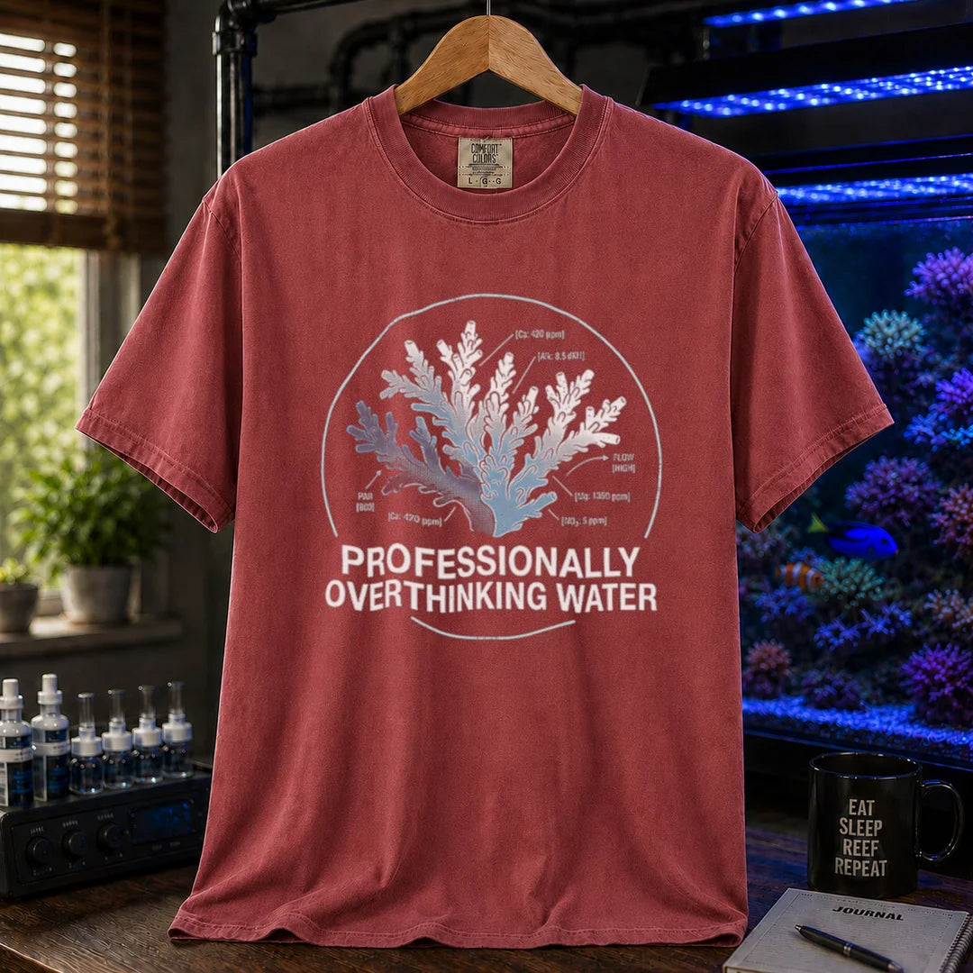 Saltwater aquarium graphic t-shirt featuring a scientific coral diagram with water parameters and text: PROFESSIONALLY OVERTHINKING WATER, maroon, red crew neck tee