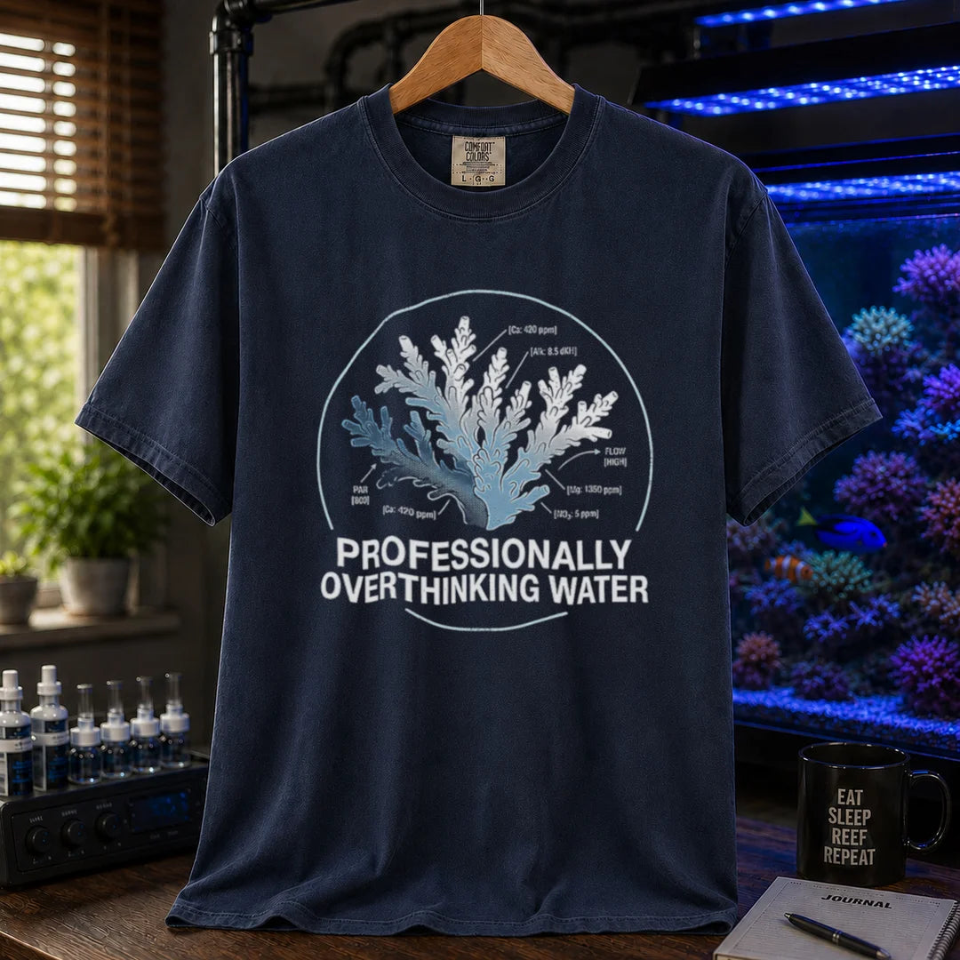 Saltwater aquarium graphic t-shirt featuring a scientific coral diagram with water parameters and text: PROFESSIONALLY OVERTHINKING WATER, navy crew neck tee