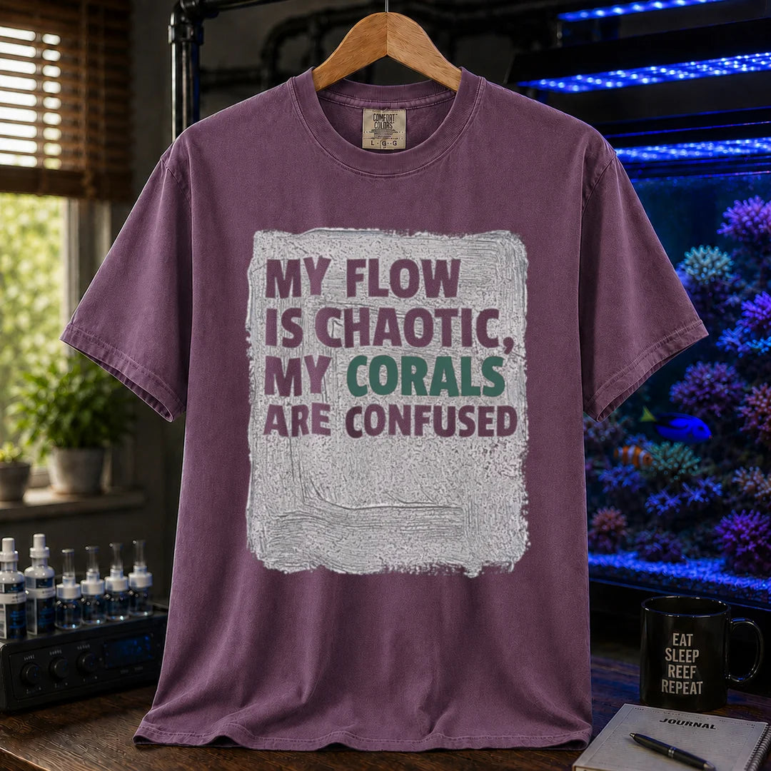 Saltwater aquarium graphic t-shirt featuring distressed brushstroke background and text: MY FLOW IS CHAOTIC, MY CORALS ARE CONFUSED, purple crew neck tee