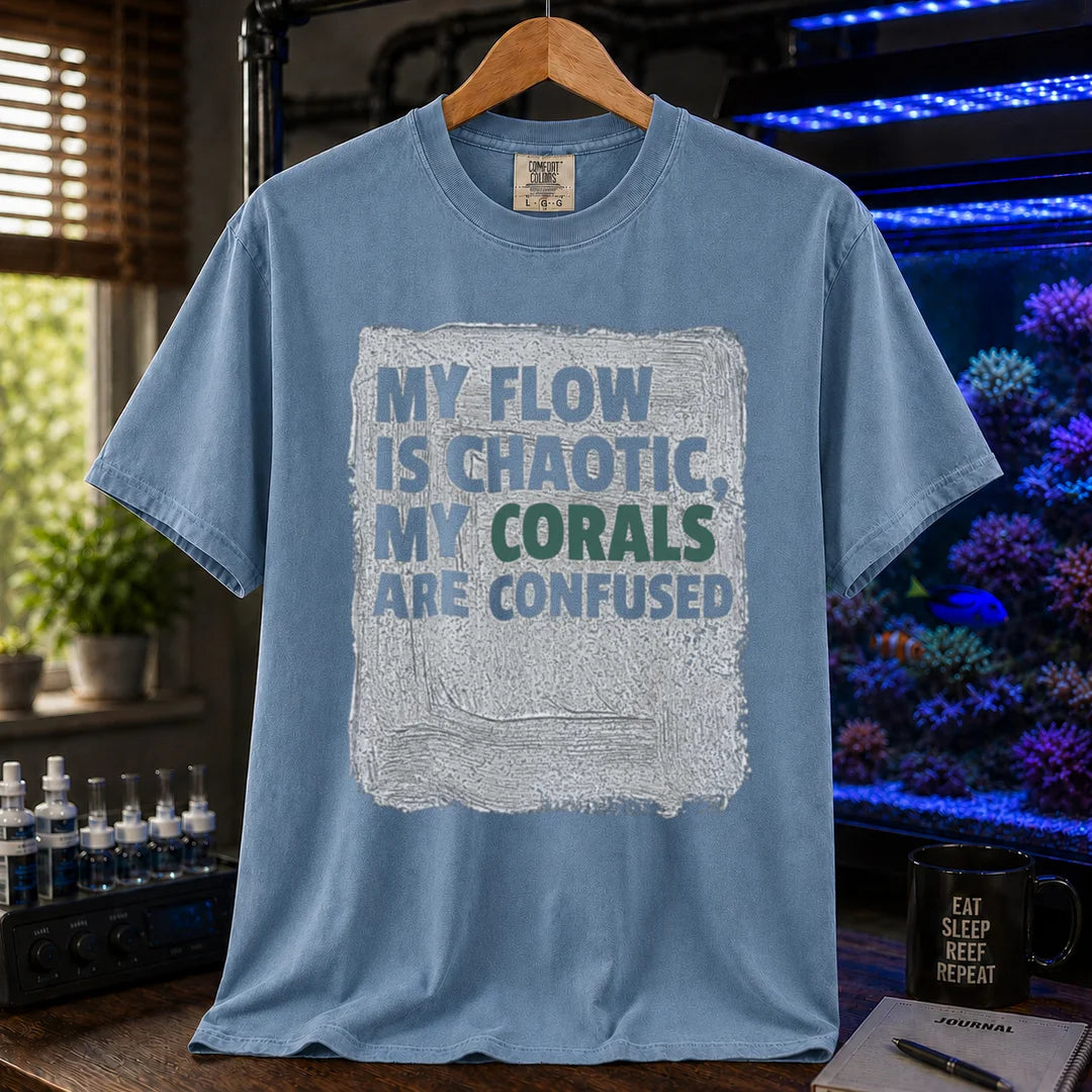 Saltwater aquarium graphic t-shirt featuring distressed brushstroke background and text: MY FLOW IS CHAOTIC, MY CORALS ARE CONFUSED, blue crew neck tee