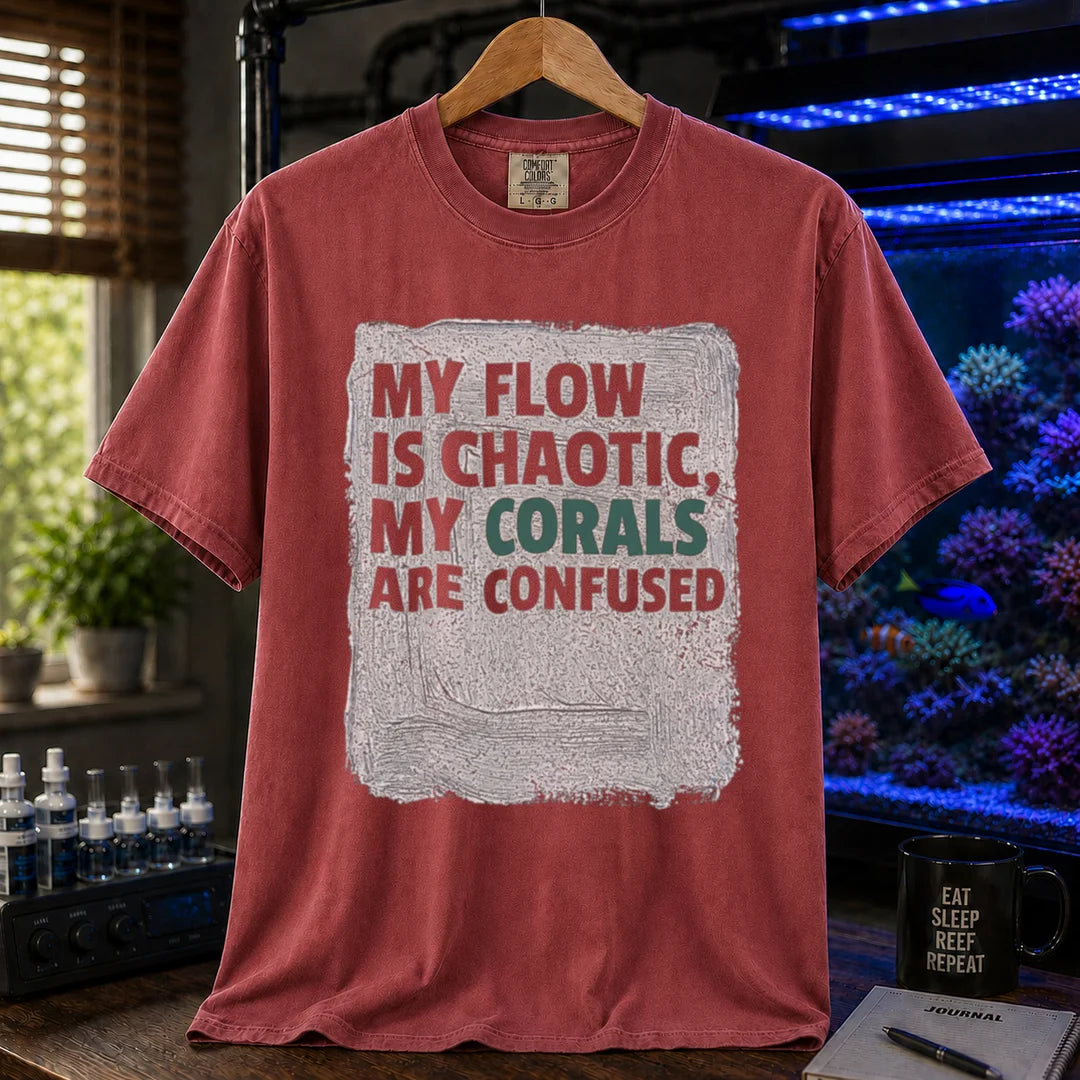 Saltwater aquarium graphic t-shirt featuring distressed brushstroke background and text: MY FLOW IS CHAOTIC, MY CORALS ARE CONFUSED, maroon, red crew neck tee