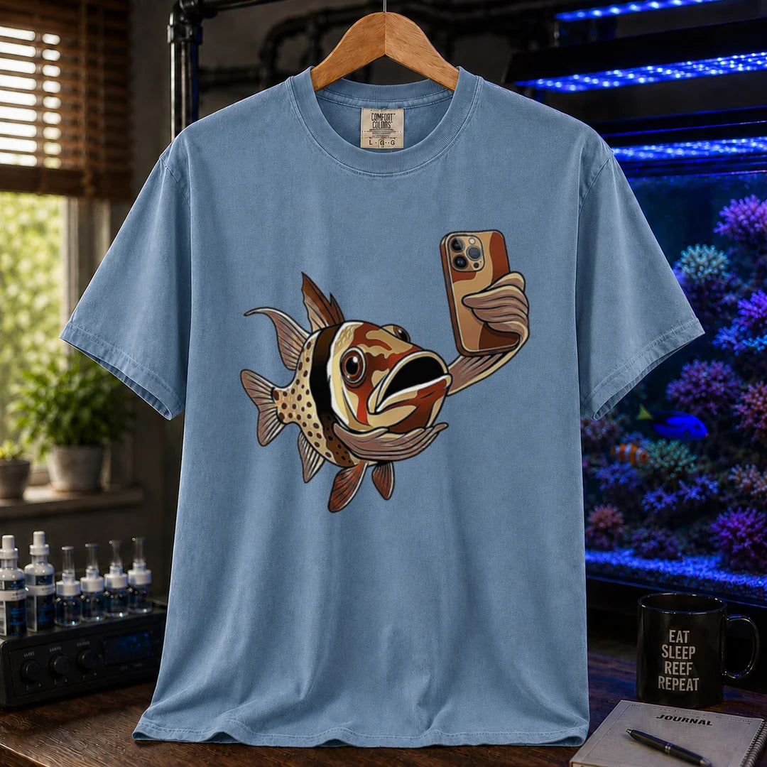 Saltwater aquarium graphic t-shirt featuring a pajama cardinalfish taking a selfie with a smartphone, blue crew neck tee