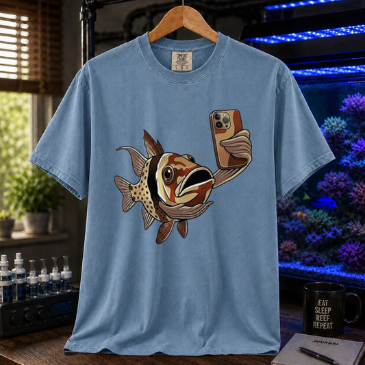 Saltwater aquarium graphic t-shirt featuring a pajama cardinalfish taking a selfie with a smartphone, blue crew neck tee