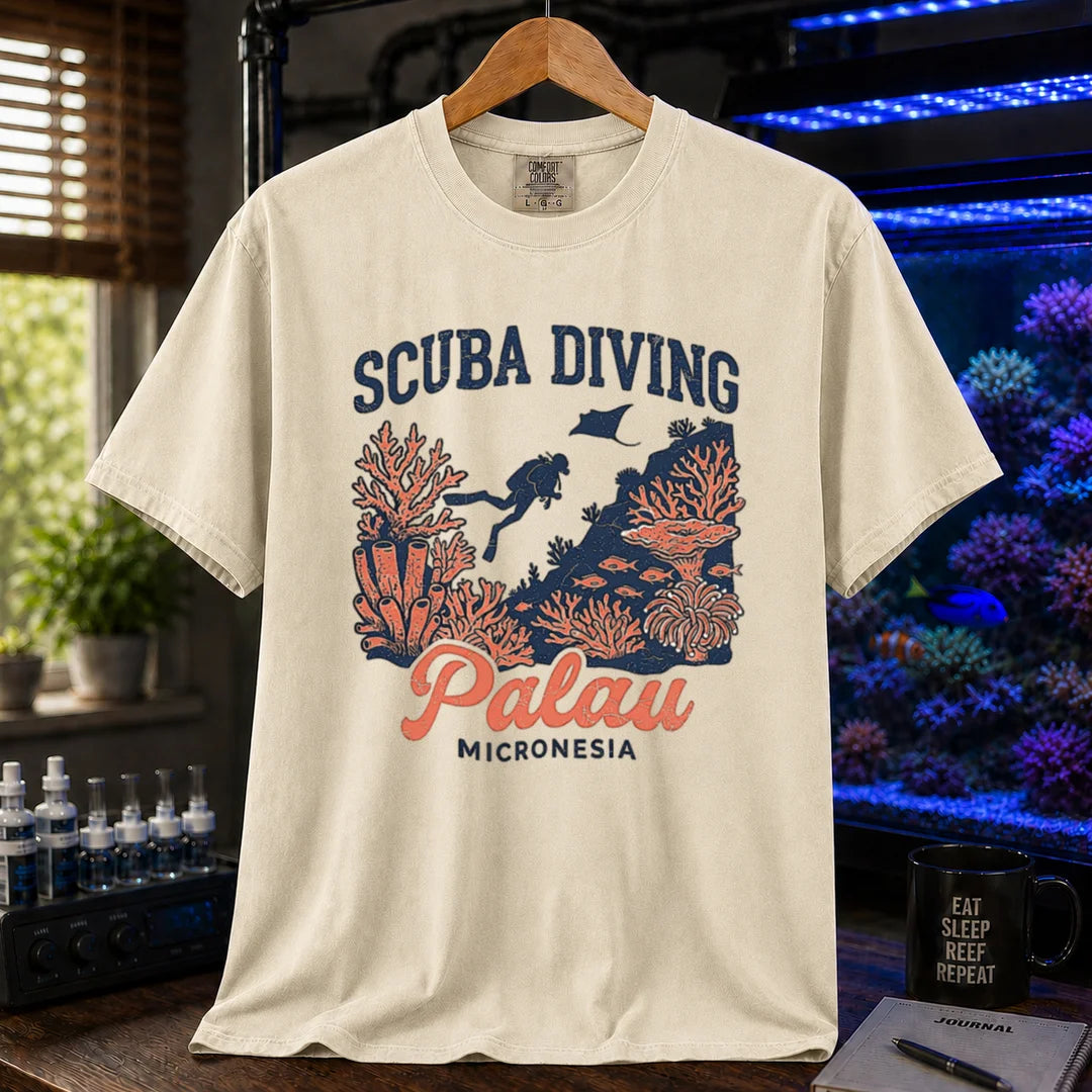 Saltwater aquarium graphic t-shirt featuring a scuba diver and coral reef illustration with text: SCUBA DIVING Palau MICRONESIA, cream, beige, ivory crew neck tee