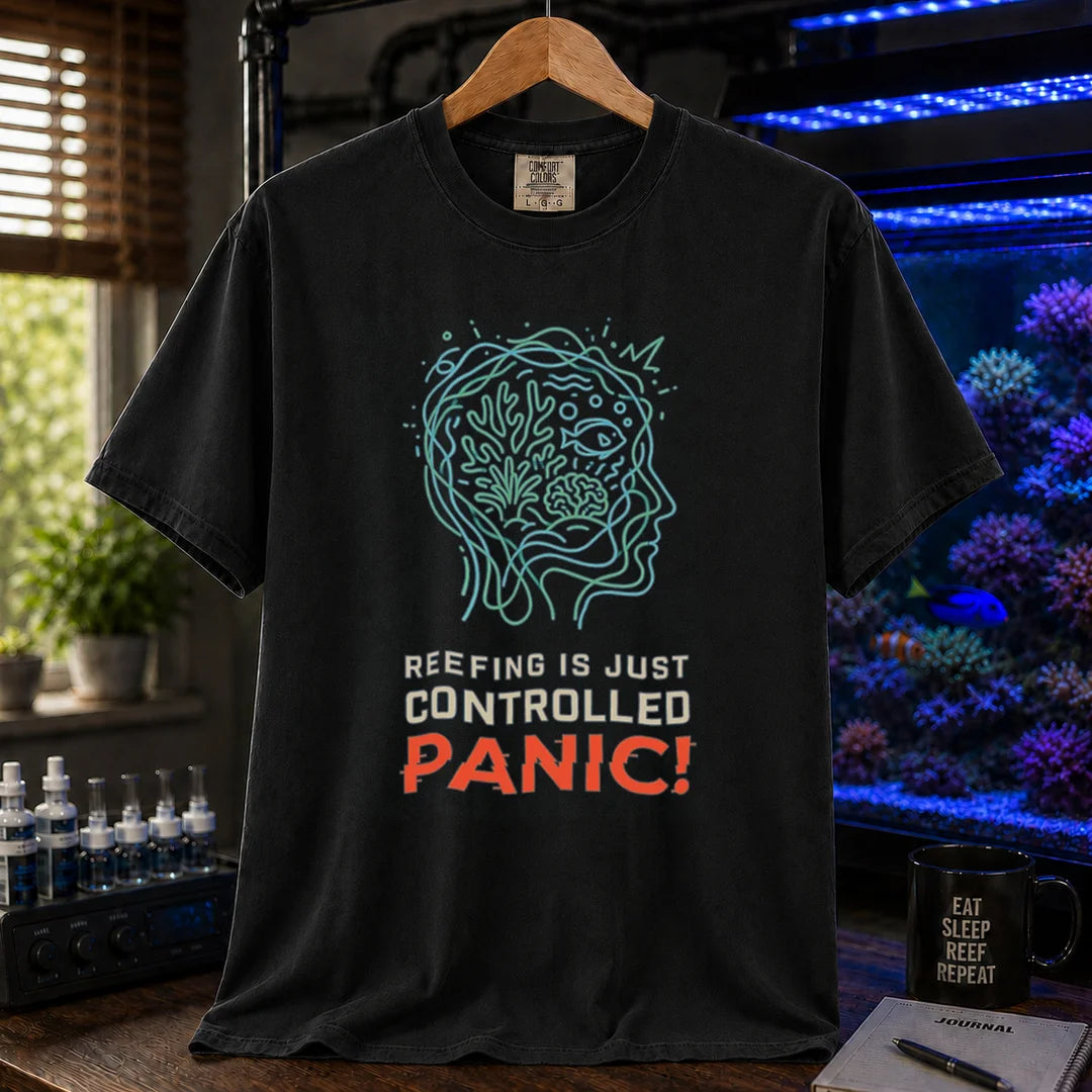 Saltwater aquarium graphic t-shirt featuring a brain/reef head outline illustration and text: REEFING IS JUST CONTROLLED PANIC!, black crew neck tee