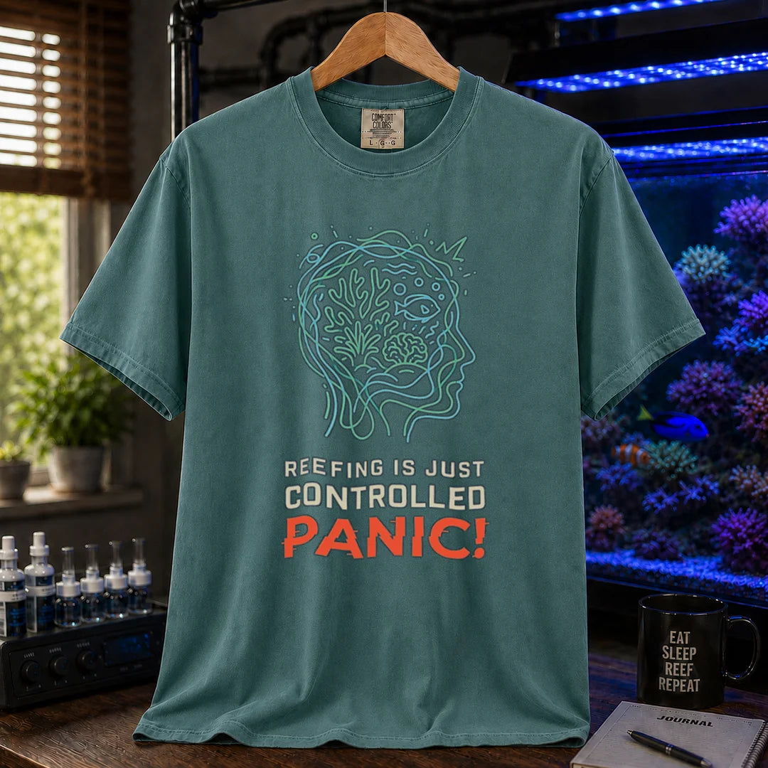 Saltwater aquarium graphic t-shirt featuring a brain/reef head outline illustration and text: REEFING IS JUST CONTROLLED PANIC!, green crew neck tee