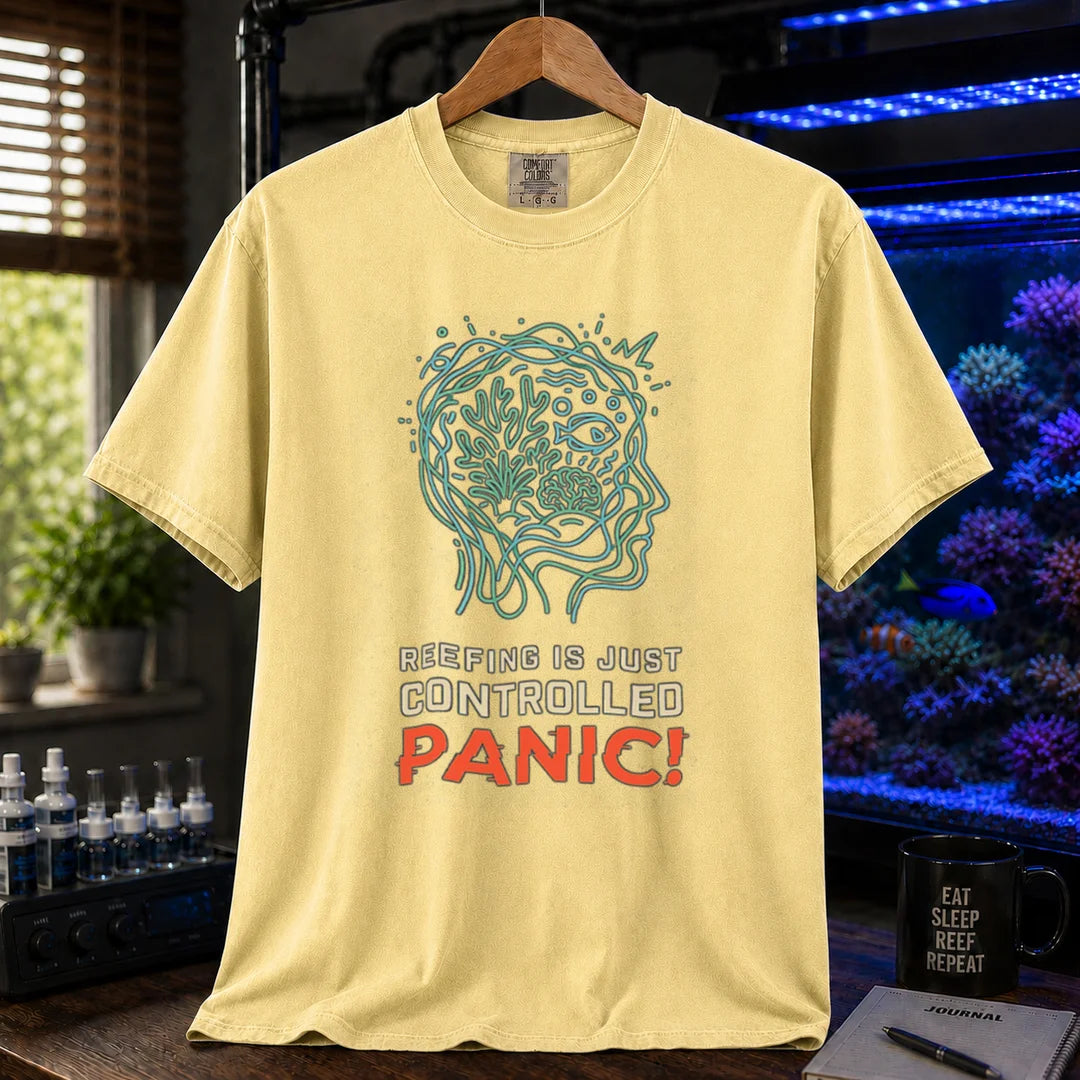 Saltwater aquarium graphic t-shirt featuring a brain/reef head outline illustration and text: REEFING IS JUST CONTROLLED PANIC!, yellow crew neck tee
