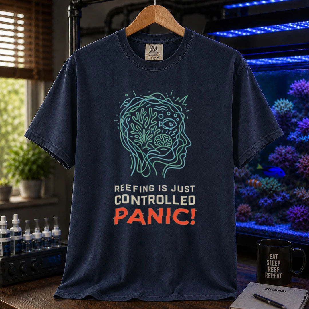 Saltwater aquarium graphic t-shirt featuring a brain/reef head outline illustration and text: REEFING IS JUST CONTROLLED PANIC!, navy crew neck tee