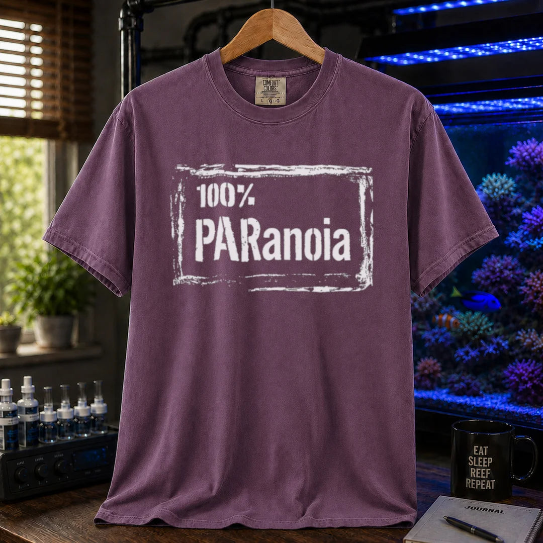 Saltwater aquarium graphic t-shirt featuring a distressed box frame and text: 100% PARANOIA, purple crew neck tee