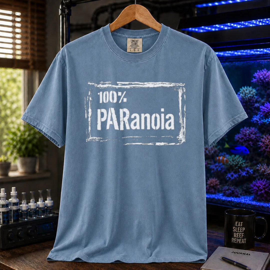 Saltwater aquarium graphic t-shirt featuring a distressed box frame and text: 100% PARANOIA, blue crew neck tee