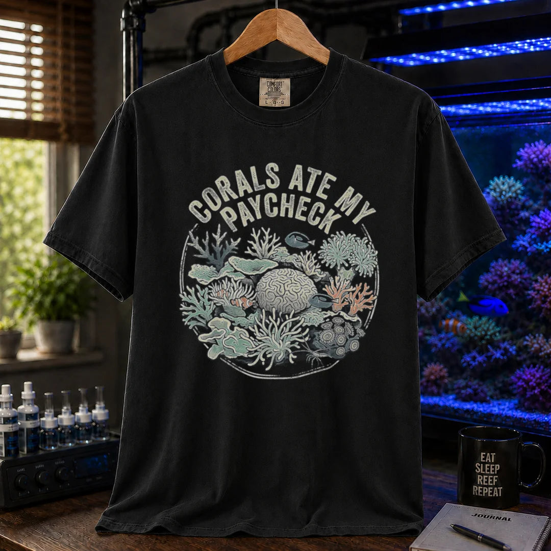 Saltwater aquarium graphic t-shirt featuring a circular coral reef illustration and text: CORALS ATE MY PAYCHECK, black crew neck tee