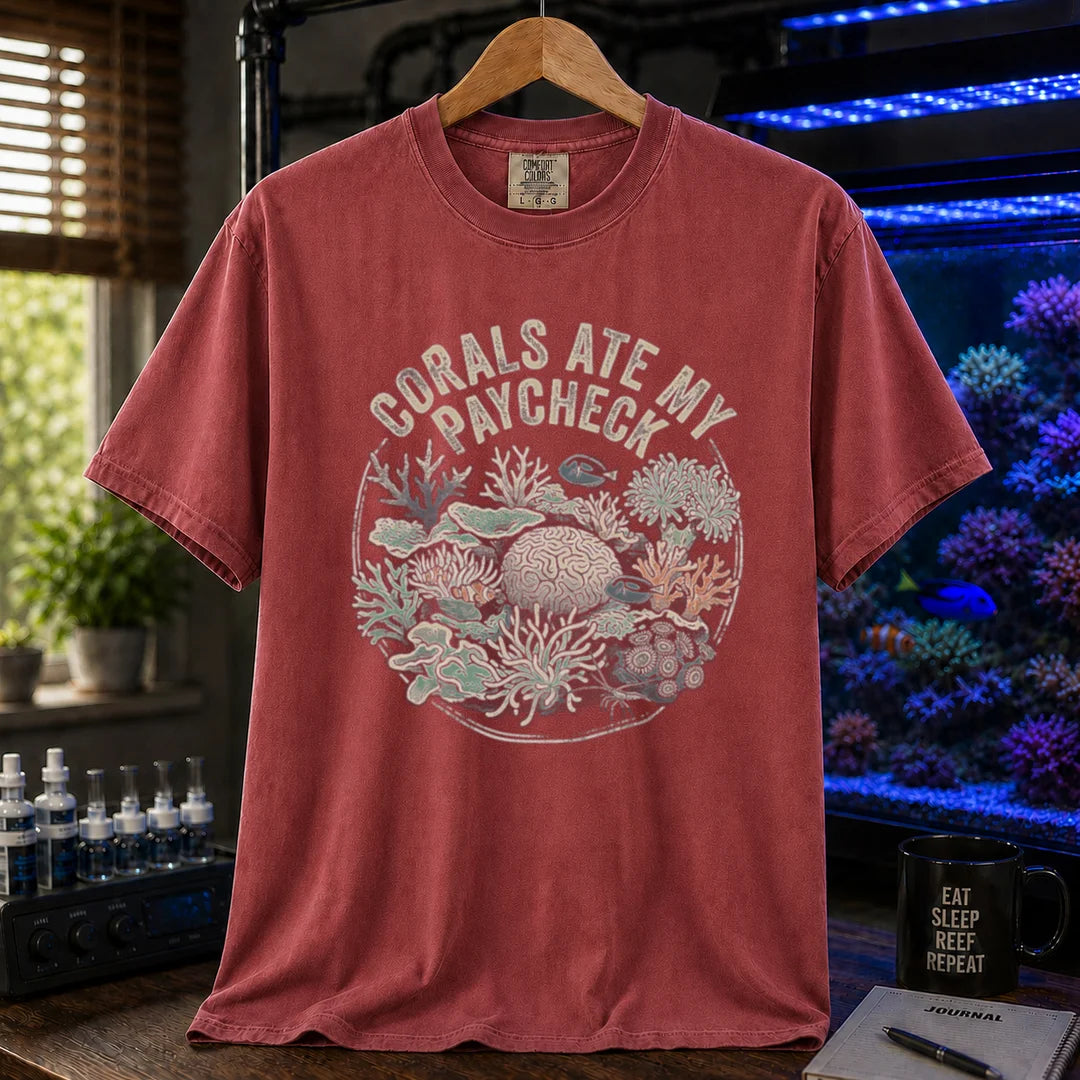 Saltwater aquarium graphic t-shirt featuring a circular coral reef illustration and text: CORALS ATE MY PAYCHECK, maroon, red crew neck tee