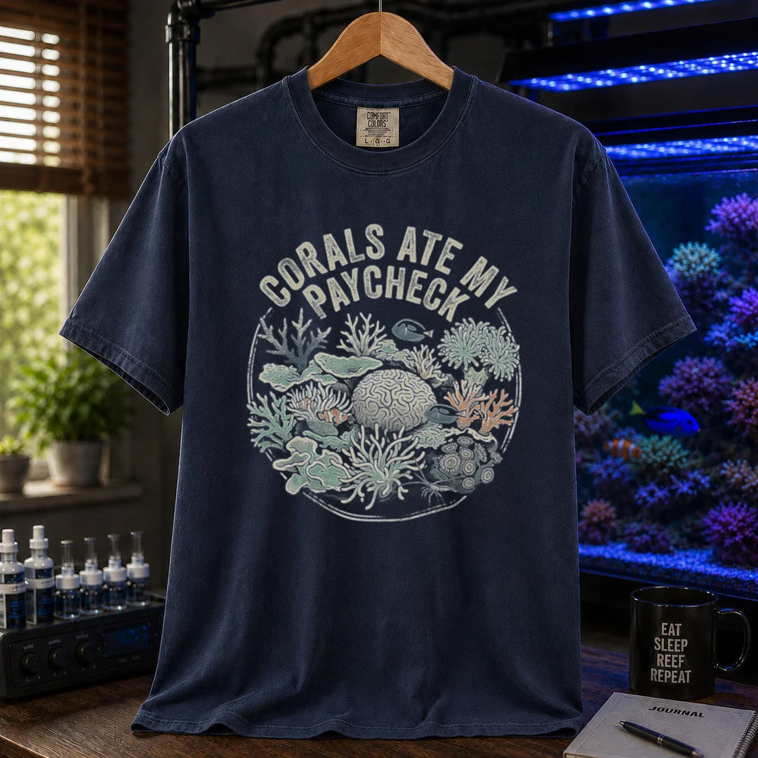 Saltwater aquarium graphic t-shirt featuring a circular coral reef illustration and text: CORALS ATE MY PAYCHECK, navy crew neck tee