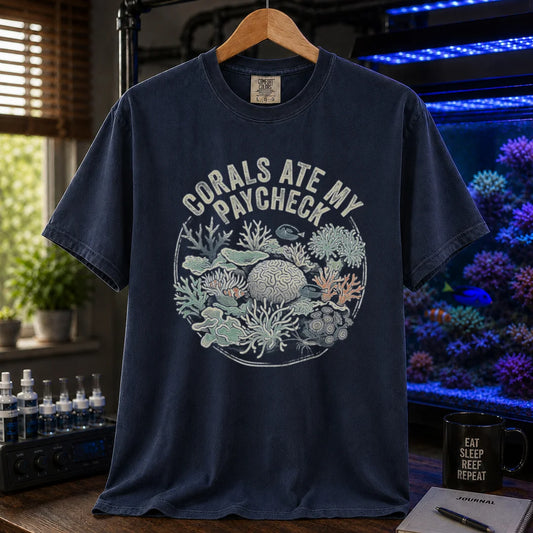 Saltwater aquarium graphic t-shirt featuring a circular coral reef illustration and text: CORALS ATE MY PAYCHECK, navy crew neck tee