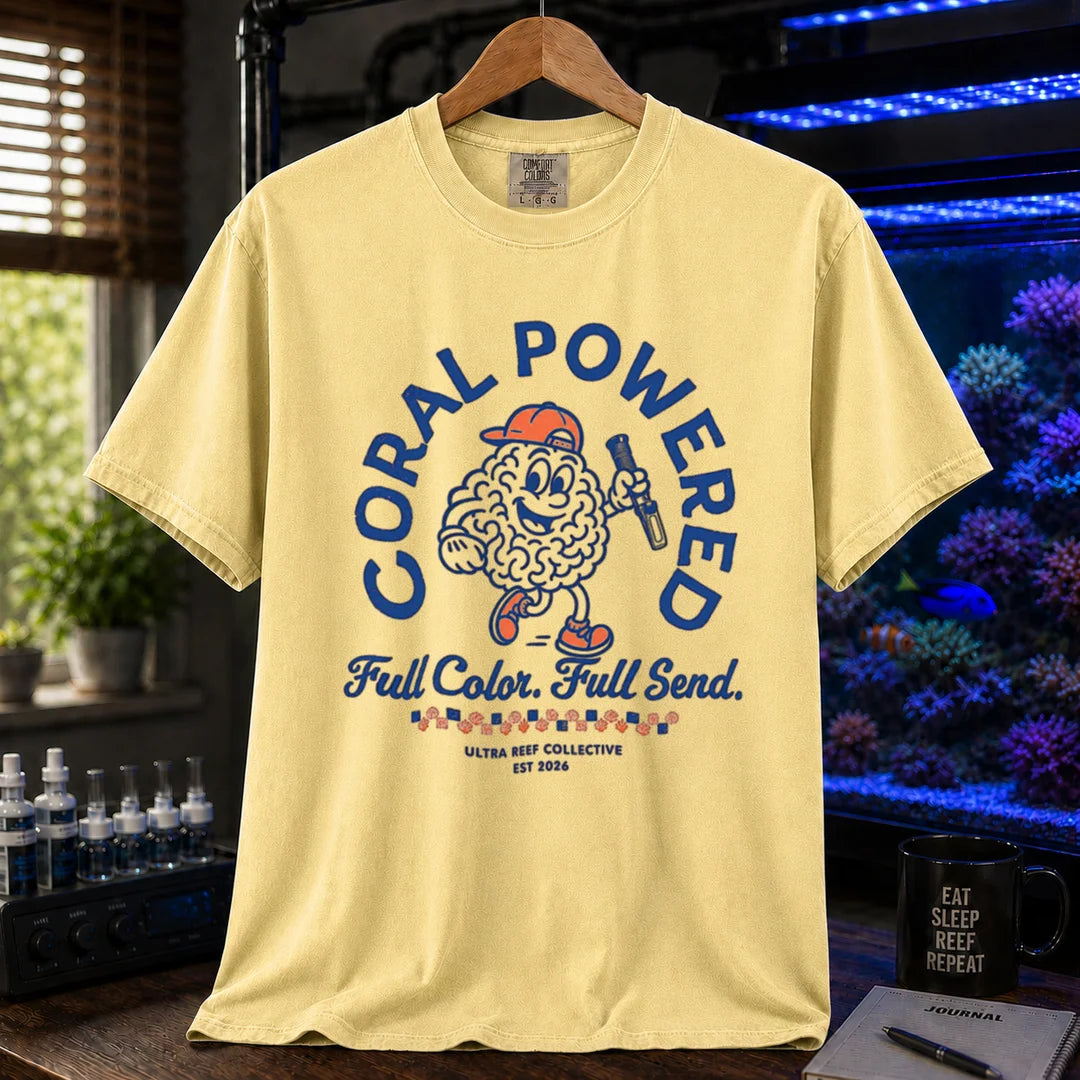 Saltwater aquarium graphic t-shirt featuring a retro cartoon brain coral mascot holding a flashlight with text: CORAL POWERED Full Color. Full Send., yellow crew neck tee