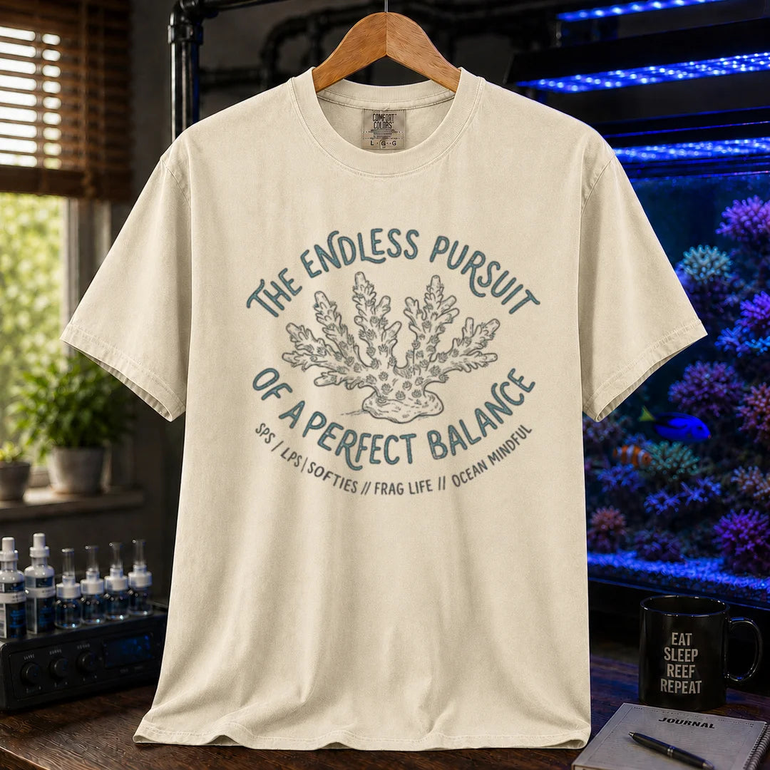 Saltwater aquarium graphic t-shirt featuring an Acropora coral illustration and text: THE ENDLESS PURSUIT OF A PERFECT BALANCE SPS / LPS / SOFTIES // FRAG LIFE // OCEAN MINDFUL, cream, beige, ivory crew neck tee