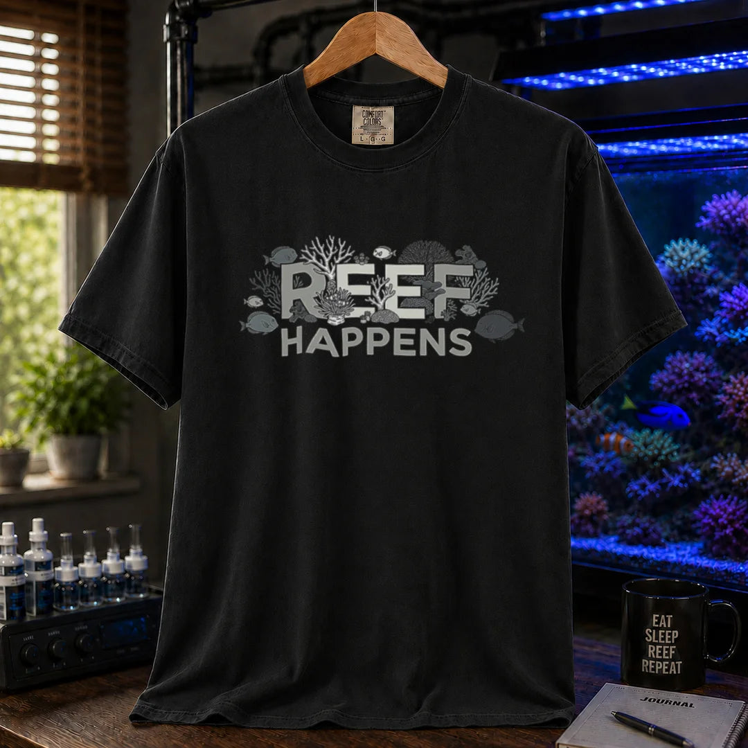 Saltwater aquarium graphic t-shirt featuring text reading REEF HAPPENS with embedded coral and fish illustrations, black crew neck tee