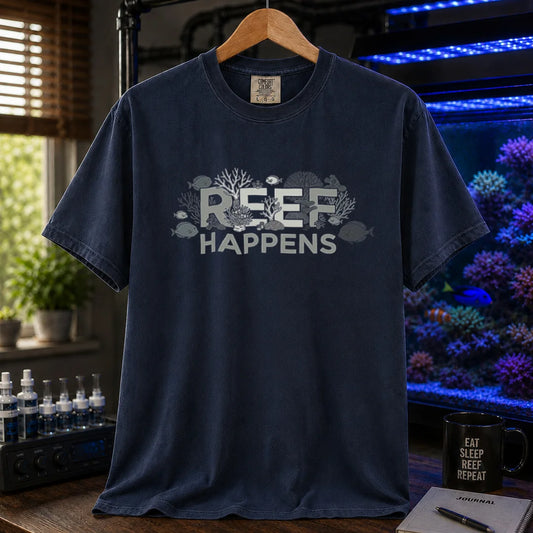 Saltwater aquarium graphic t-shirt featuring text reading REEF HAPPENS with embedded coral and fish illustrations, navy crew neck tee