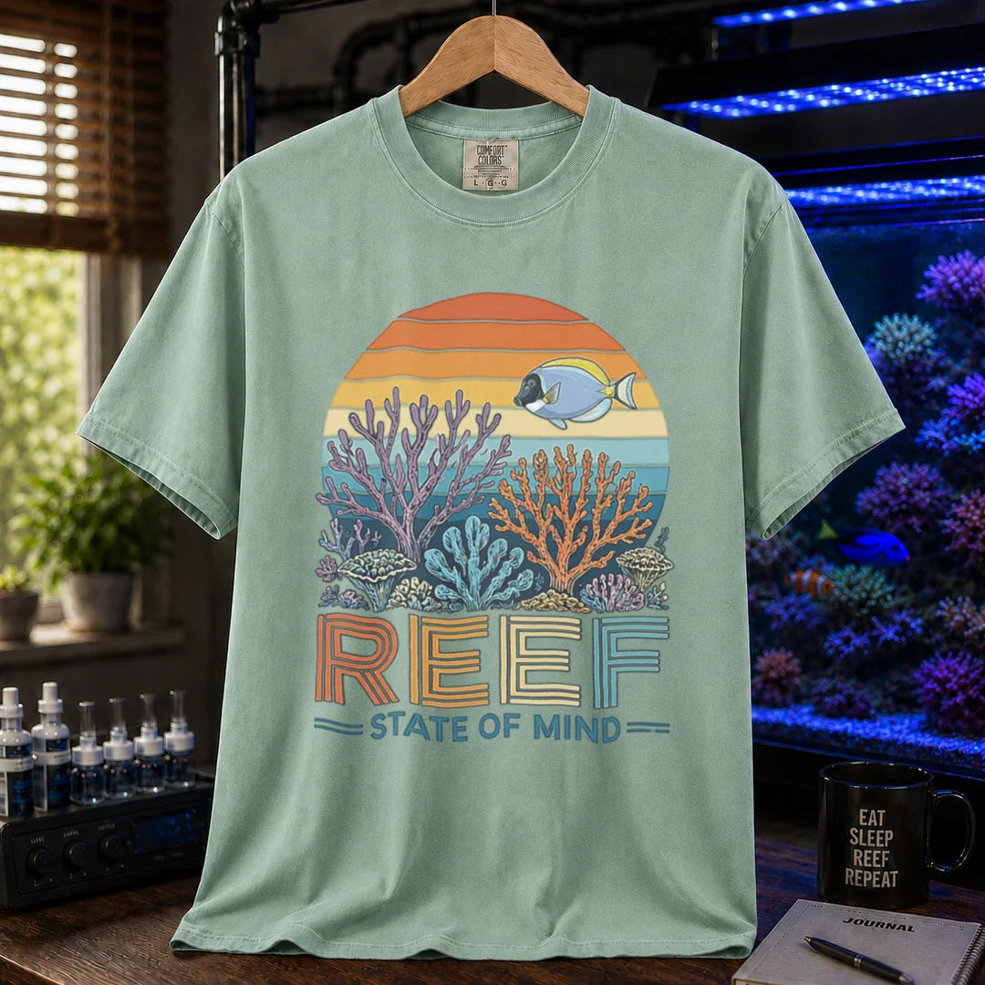 Saltwater aquarium graphic t-shirt featuring a retro sunset reef landscape and text: REEF STATE OF MIND, green crew neck tee