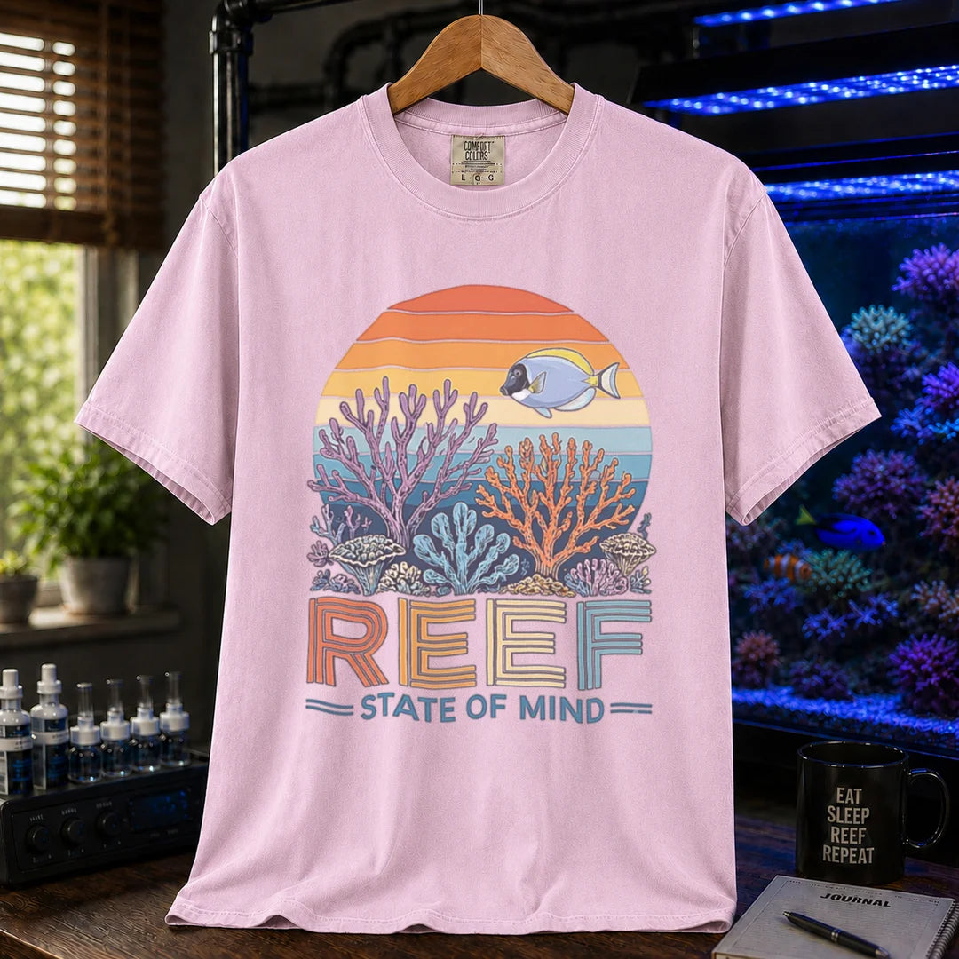 Saltwater aquarium graphic t-shirt featuring a retro sunset reef landscape and text: REEF STATE OF MIND, pink crew neck tee