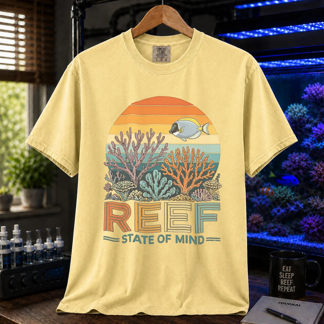 Saltwater aquarium graphic t-shirt featuring a retro sunset reef landscape and text: REEF STATE OF MIND, yellow crew neck tee