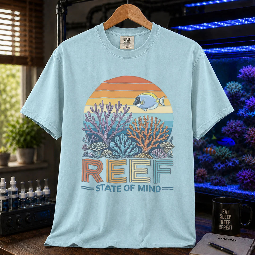 Saltwater aquarium graphic t-shirt featuring a retro sunset reef landscape and text: REEF STATE OF MIND, light blue crew neck tee
