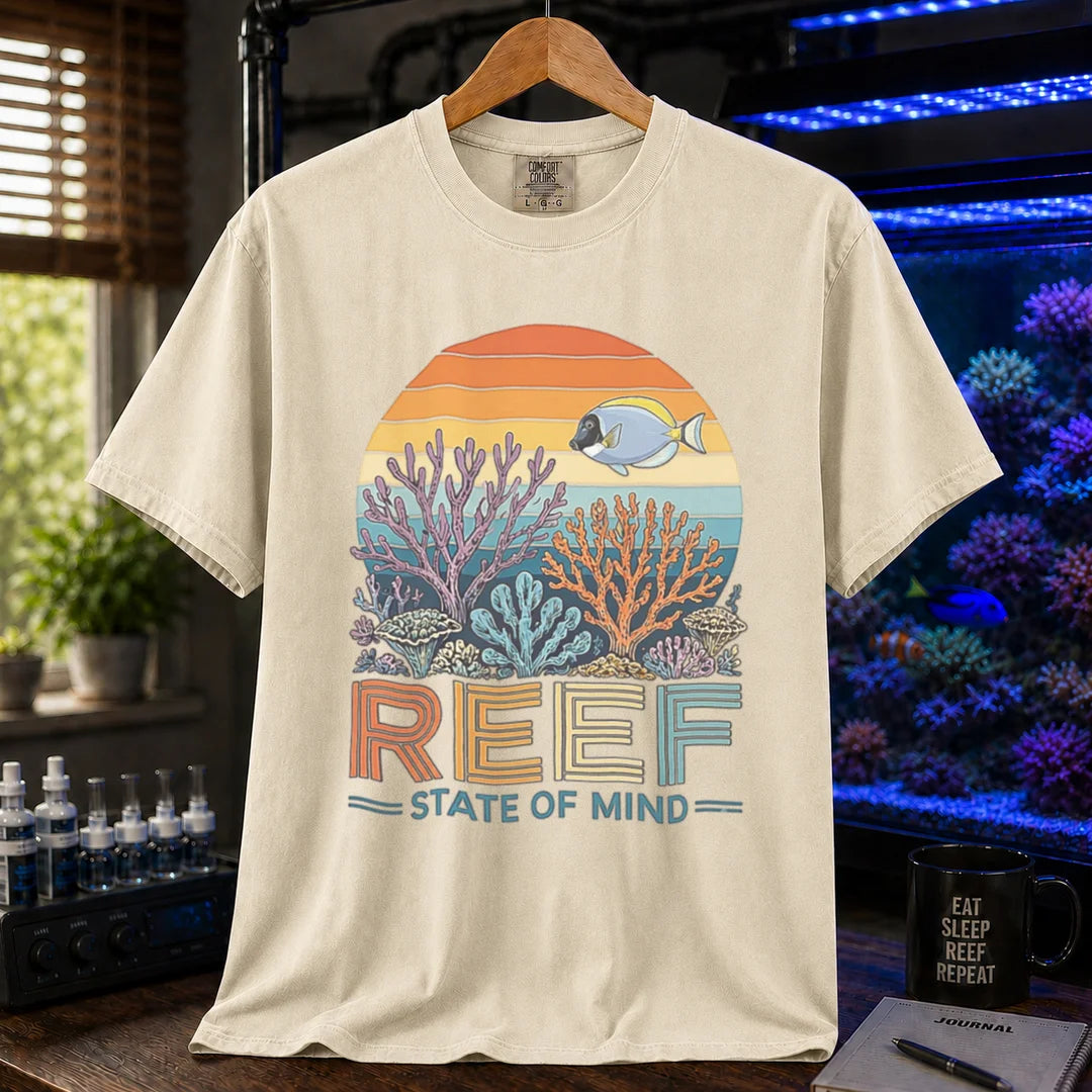Saltwater aquarium graphic t-shirt featuring a retro sunset reef landscape and text: REEF STATE OF MIND, ivory crew neck tee