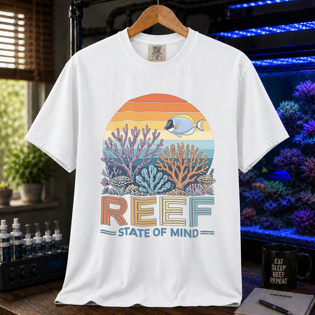 Saltwater aquarium graphic t-shirt featuring a retro sunset reef landscape and text: REEF STATE OF MIND, white crew neck tee