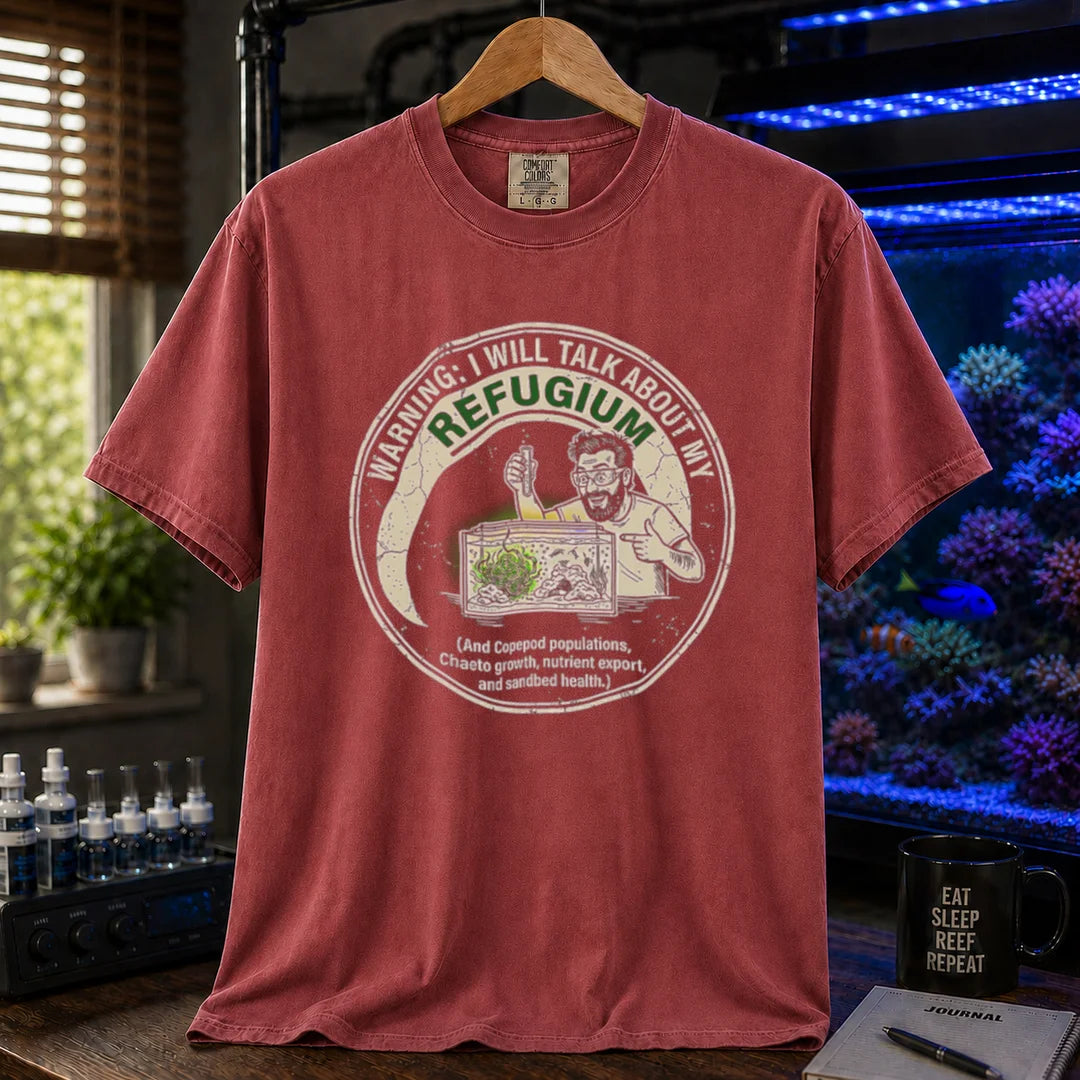 Saltwater aquarium graphic t-shirt featuring an illustration of an aquarist tending a refugium with text: WARNING: I WILL TALK ABOUT MY REFUGIUM (And Copepod populations, Chaeto growth, nutrient export, and sandbed health.), maroon, red crew neck tee