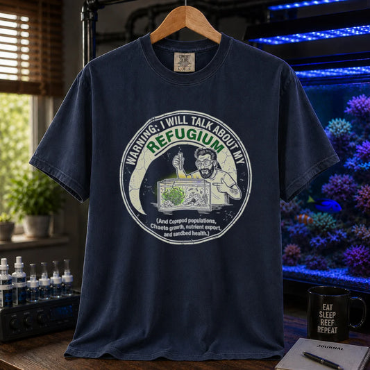 Saltwater aquarium graphic t-shirt featuring an illustration of an aquarist tending a refugium with text: WARNING: I WILL TALK ABOUT MY REFUGIUM (And Copepod populations, Chaeto growth, nutrient export, and sandbed health.), navy crew neck tee