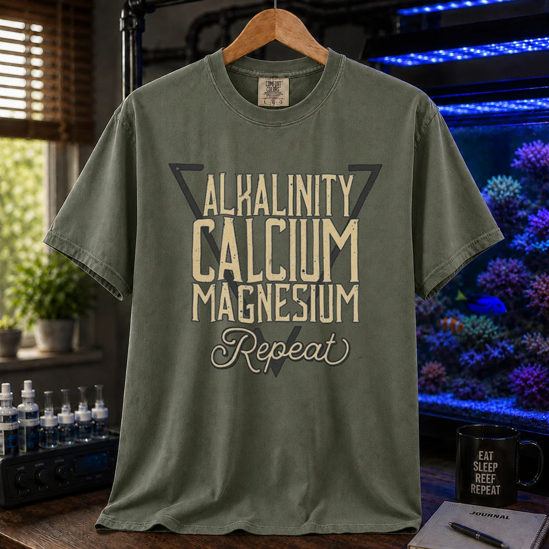 Saltwater aquarium graphic t-shirt featuring a triangle frame and text: ALKALINITY CALCIUM MAGNESIUM Repeat, military green crew neck tee
