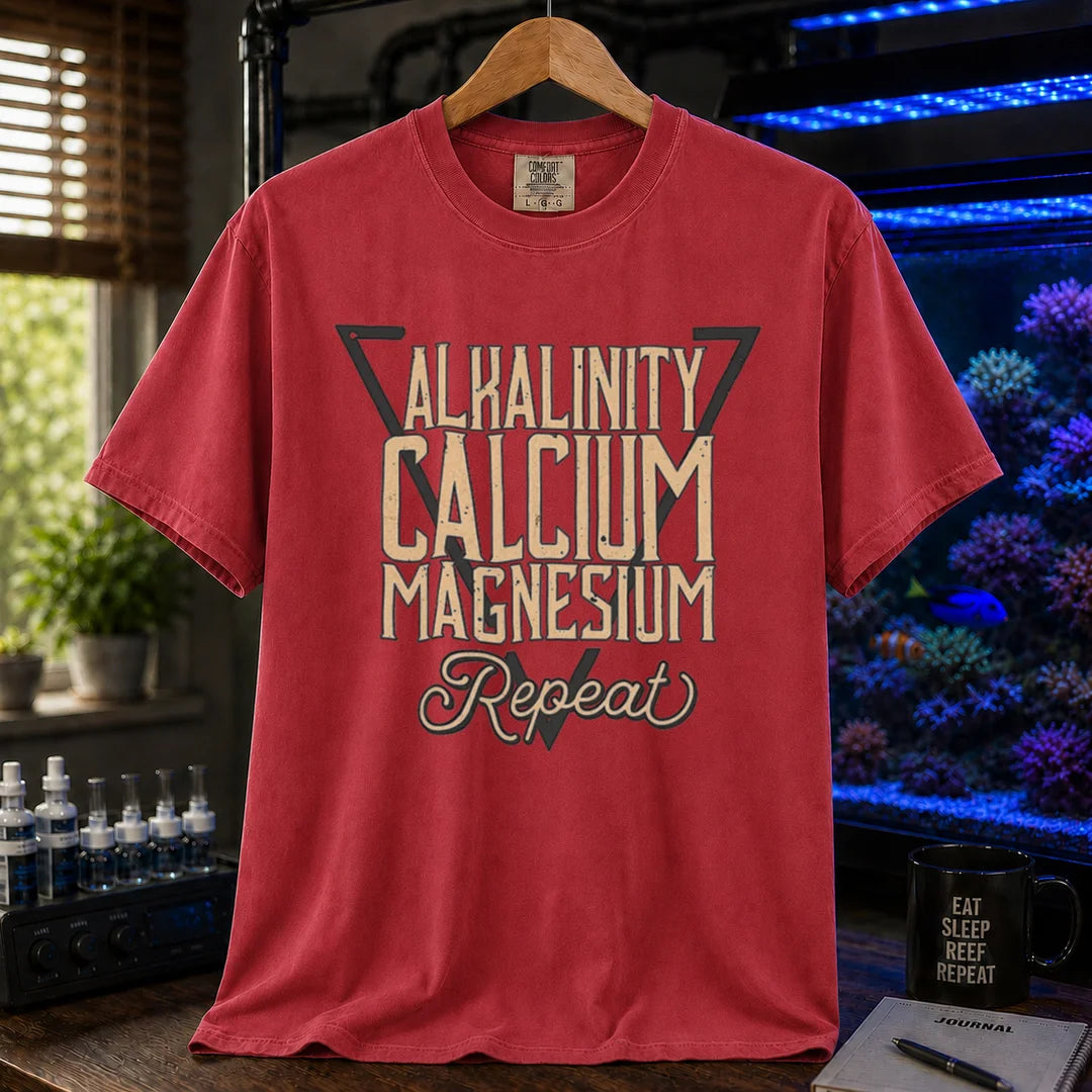 Saltwater aquarium graphic t-shirt featuring a triangle frame and text: ALKALINITY CALCIUM MAGNESIUM Repeat, maroon, red crew neck tee