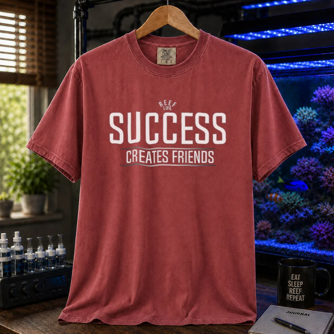 Saltwater aquarium graphic t-shirt featuring text: REEF LIFE SUCCESS CREATES FRIENDS, maroon, red crew neck tee