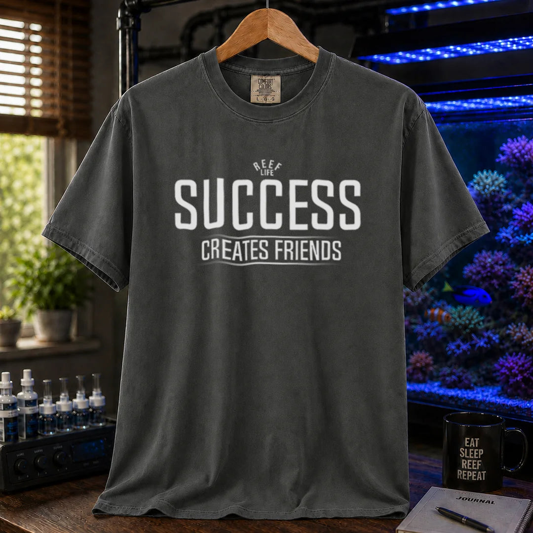 Saltwater aquarium graphic t-shirt featuring text: REEF LIFE SUCCESS CREATES FRIENDS, dark grey crew neck tee
