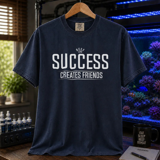 Saltwater aquarium graphic t-shirt featuring text: REEF LIFE SUCCESS CREATES FRIENDS, navy crew neck tee