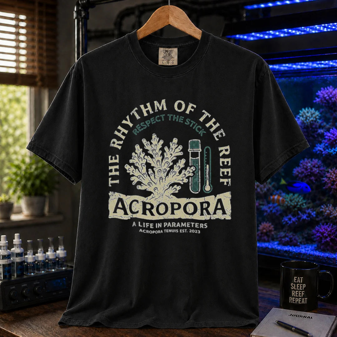 Saltwater aquarium graphic t-shirt featuring an Acropora coral and test kit illustration with text: THE RHYTHM OF THE REEF ACROPORA A LIFE IN PARAMETERS, black crew neck tee