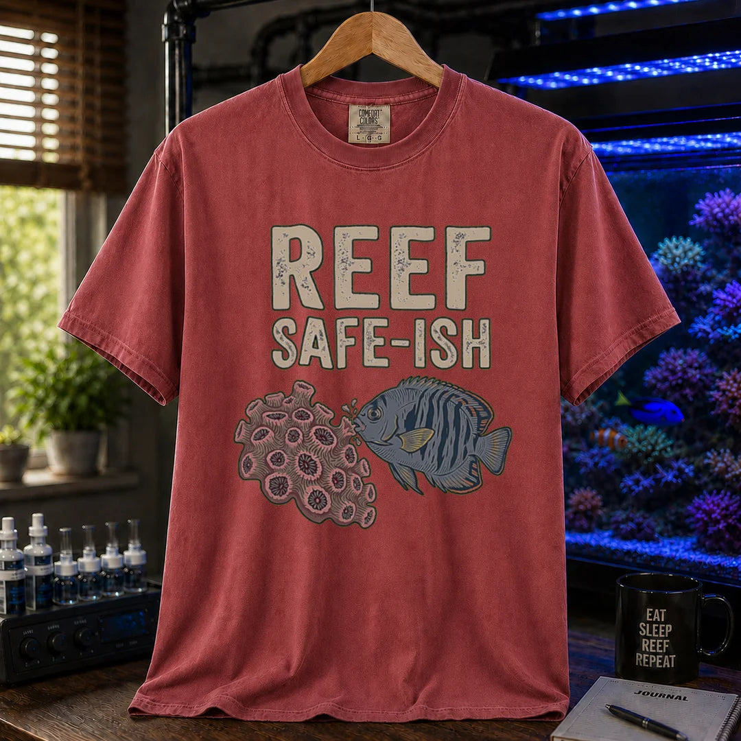 Saltwater aquarium graphic t-shirt featuring a fish nibbling coral illustration with text: REEF SAFE-ISH, maroon, red crew neck tee