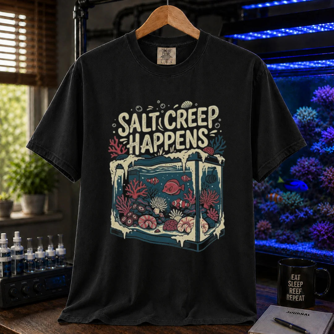 Saltwater aquarium graphic t-shirt featuring an illustration of a tank covered in salt buildup with text: SALT CREEP HAPPENS, black crew neck tee