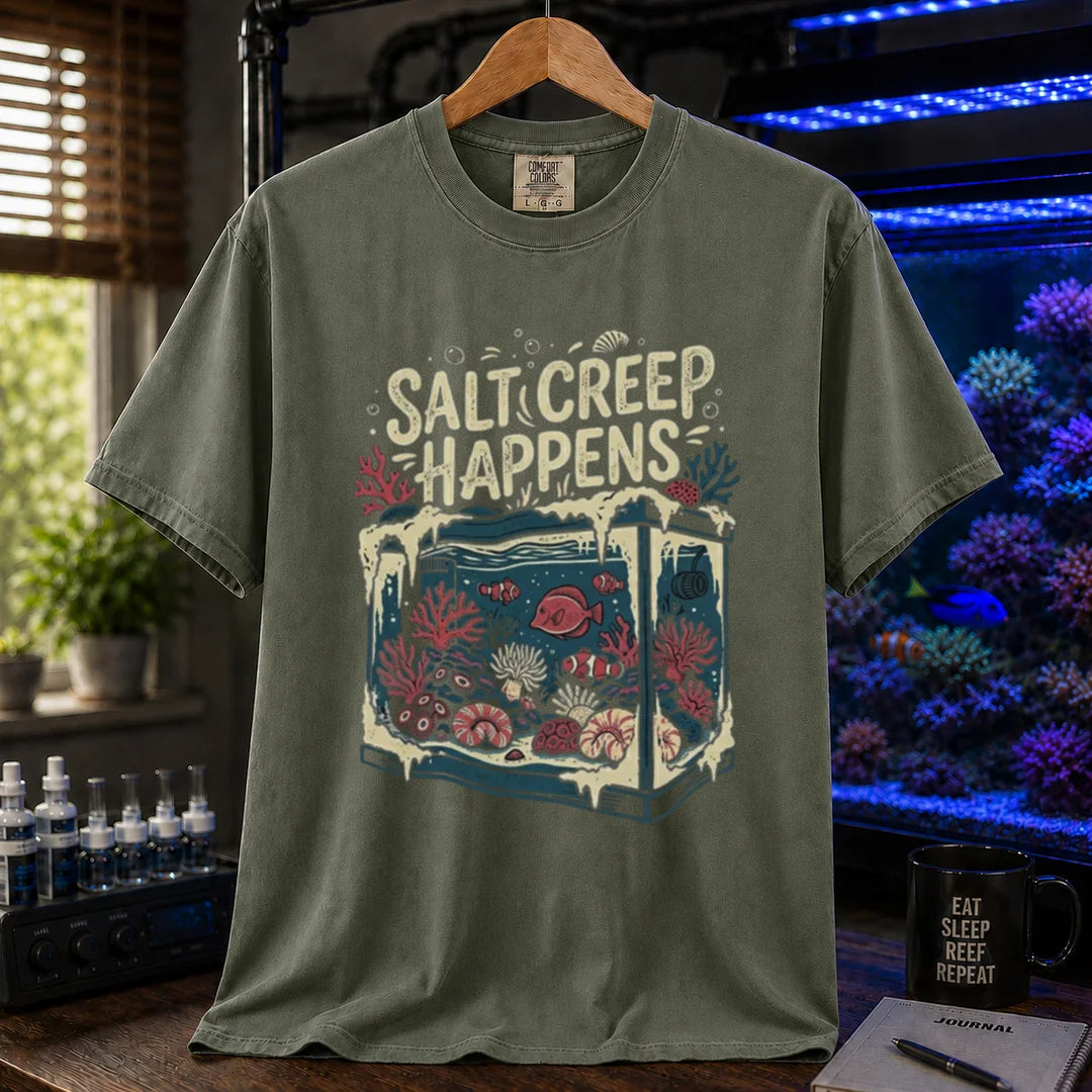 Saltwater aquarium graphic t-shirt featuring an illustration of a tank covered in salt buildup with text: SALT CREEP HAPPENS, military green crew neck tee