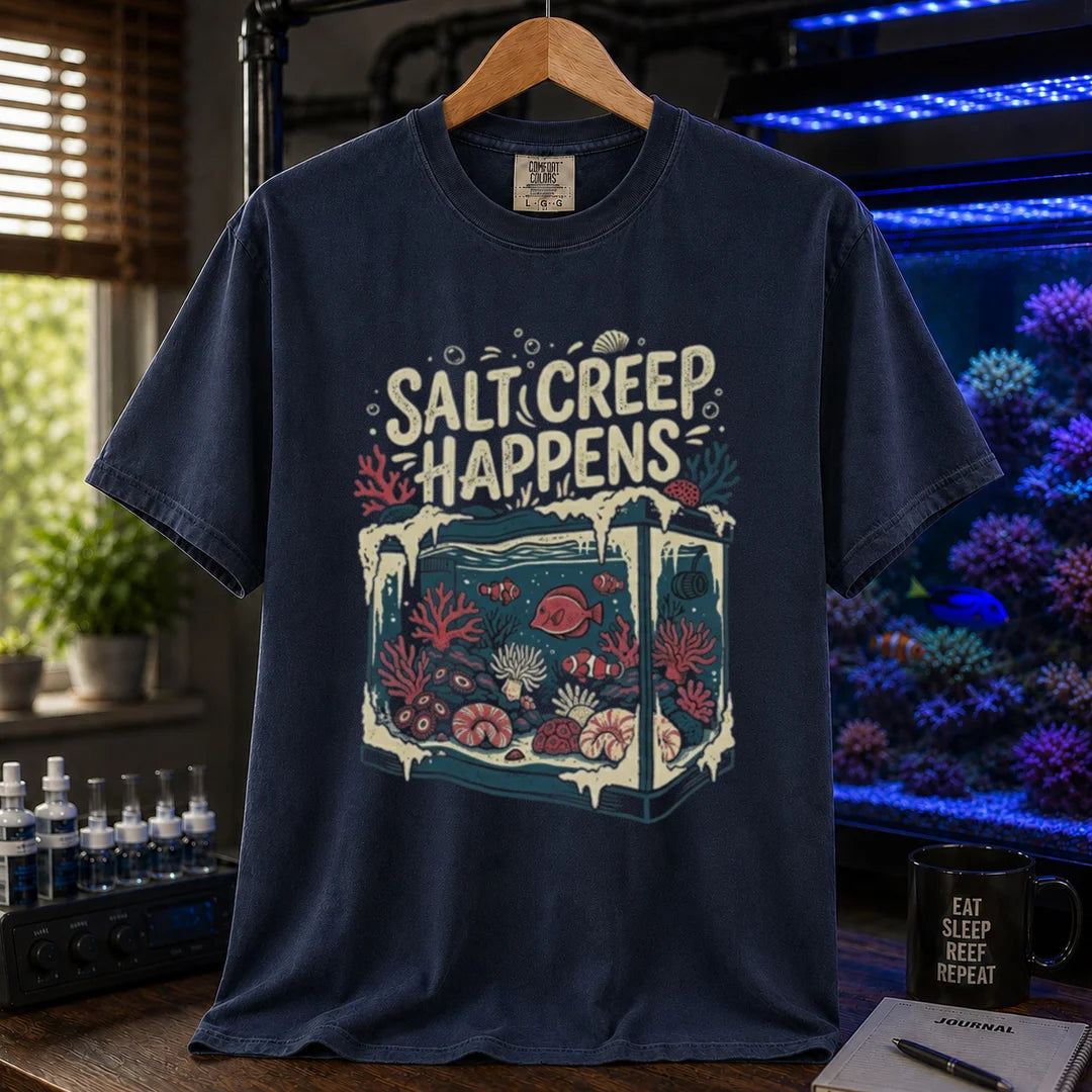 Saltwater aquarium graphic t-shirt featuring an illustration of a tank covered in salt buildup with text: SALT CREEP HAPPENS, navy crew neck tee