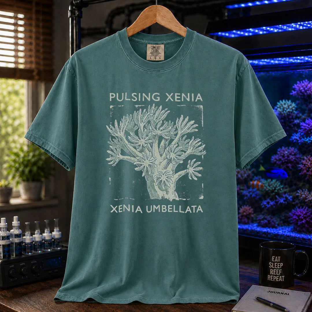 Saltwater aquarium graphic t-shirt featuring a Pulsing Xenia coral illustration with text: PULSING XENIA XENIA UMBELLATA, green crew neck tee