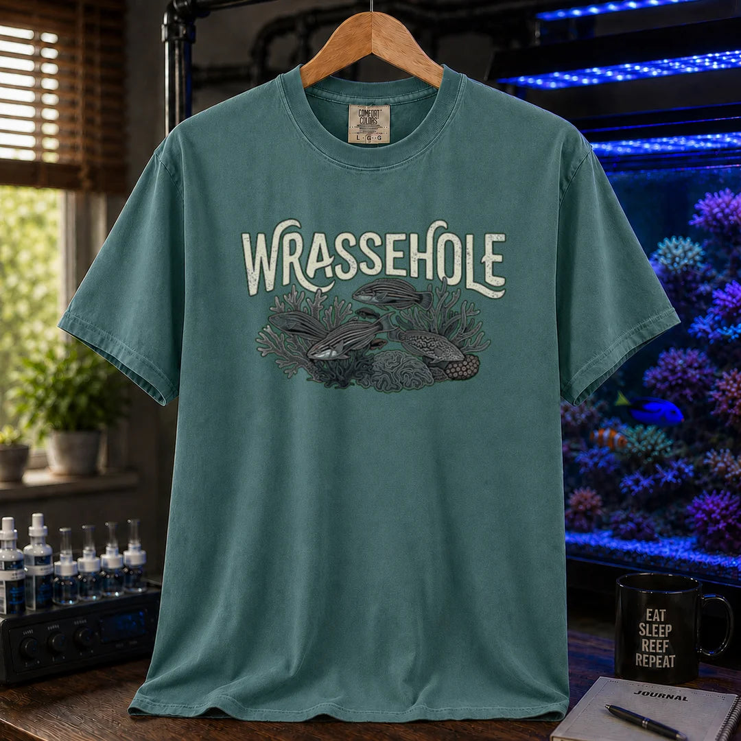 Saltwater aquarium graphic t-shirt featuring a wrasse fish reef illustration with text: WRASSEHOLE, green crew neck tee