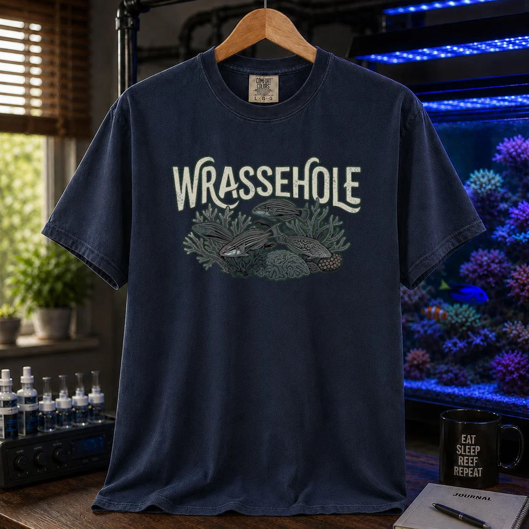 Saltwater aquarium graphic t-shirt featuring a wrasse fish reef illustration with text: WRASSEHOLE, navy crew neck tee