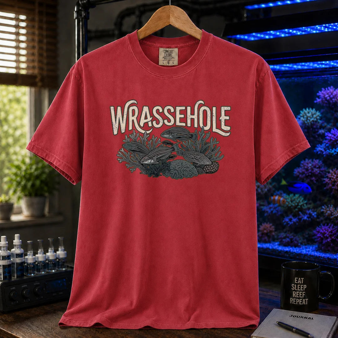 Saltwater aquarium graphic t-shirt featuring a wrasse fish reef illustration with text: WRASSEHOLE, red crew neck tee