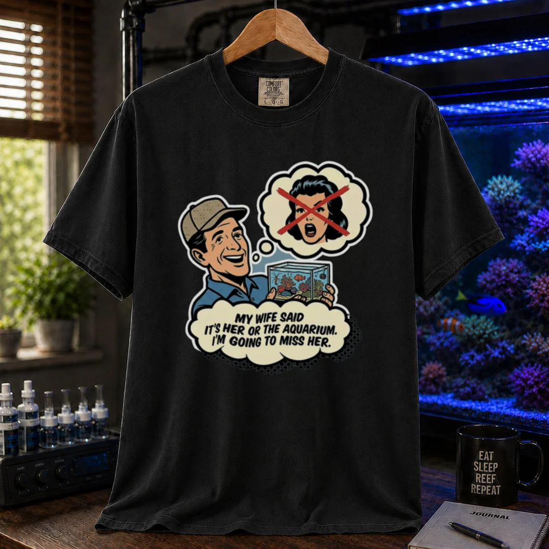 Saltwater aquarium graphic t-shirt featuring a retro comic illustration and text: MY WIFE SAID IT'S HER OR THE AQUARIUM. I'M GOING TO MISS HER., black crew neck tee