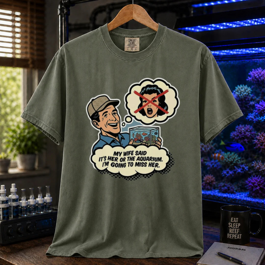 Saltwater aquarium graphic t-shirt featuring a retro comic illustration and text: MY WIFE SAID IT'S HER OR THE AQUARIUM. I'M GOING TO MISS HER., military green crew neck tee