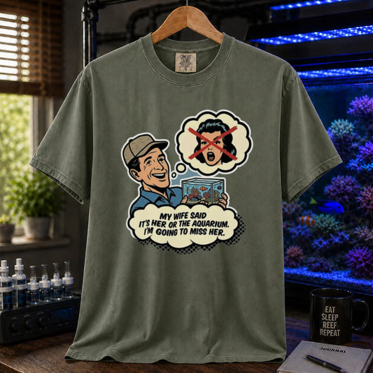 Saltwater aquarium graphic t-shirt featuring a retro comic illustration and text: MY WIFE SAID IT'S HER OR THE AQUARIUM. I'M GOING TO MISS HER., military green crew neck tee